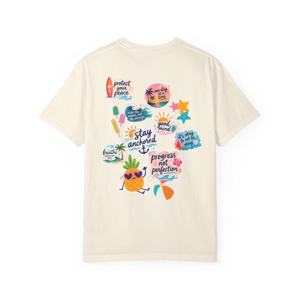 Beige T-shirt with a colorful back graphic of tropical stickers and phrases sun and sea elements note.